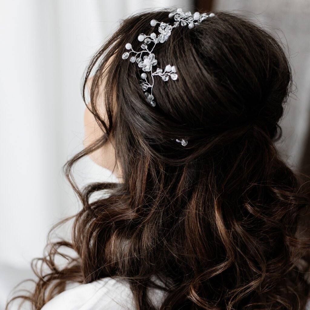 Bridal hairstyle close up, long curly brunette hair
